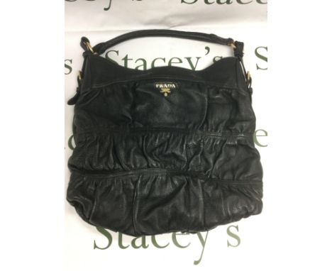 A Prada black leather shoulder bag. Shipping category B.