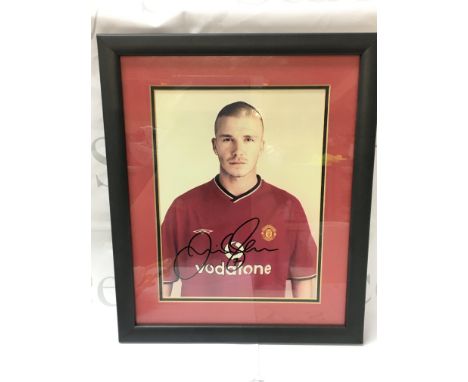 A framed and signed David Beckham print including certificate of authenticity. Postage category B