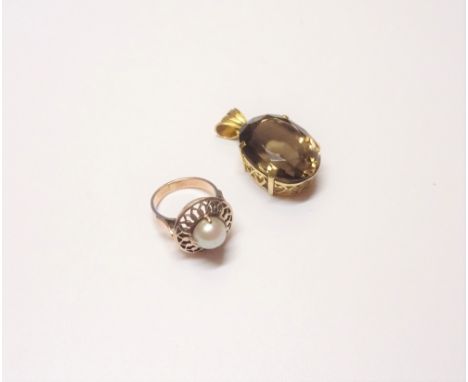 A gold ring, mounted with a cultured pearl within a pierced surround, ring size I and a half and a gold pendant, claw set wit