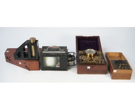 A Negeretti and Zambra barothermograph temperature recorder, circa. 1935, in an ebonised metal case, a large clinometer by E.