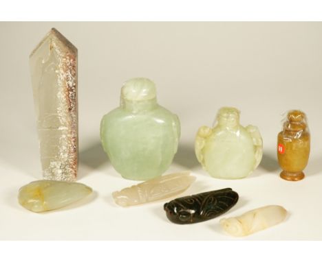 A group of Chinese jade carvings, comprising; an archaistic box and cover carved with a cicada, 11.5cm. length; four jade cic