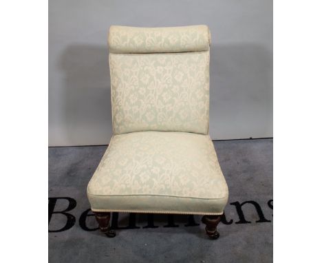 A Victorian mahogany framed nursing chair on ring turned supports, 58cm wide x 80cm high. 