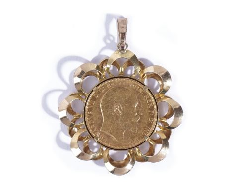An Edward VII sovereign, 1903 M, in a 9ct gold pendant mount, having a pierced looped surround, weight 10.8gms.  
