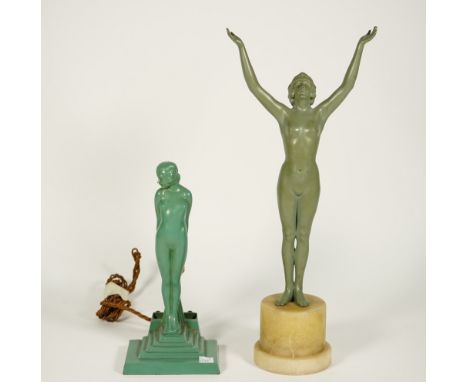 An Art Deco figural table lamp, verdigris patinated metal, depicting a female nude on a stepped rectangular base, 26cm high, 