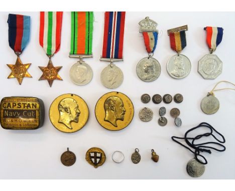 Four Second World War medals, comprising; The 1939-45 Star, The Italy Star, The Defence Medal and The War Medal, with a named