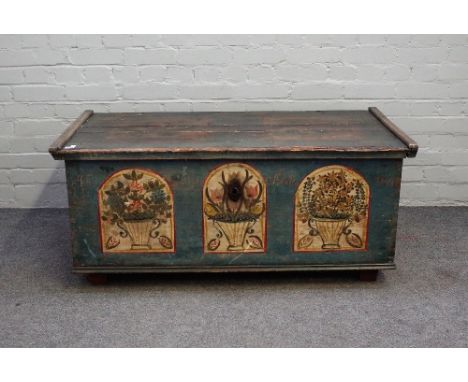A 19th century North European polychrome painted pine rectangular lift top trunk, on block feet, 119cm wide x 53cm high