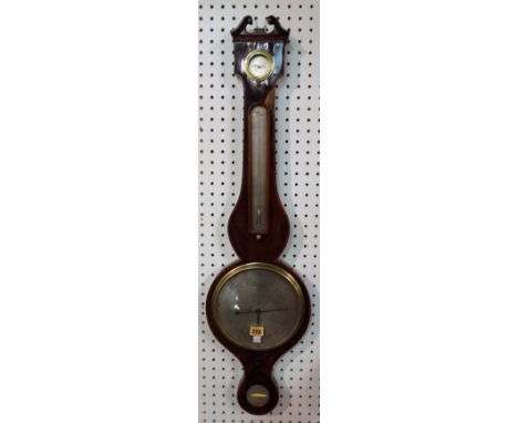 A Victorian mahogany wheel barometer by A. Pagan, Nottingham, with broken arch pediment, dry/ damp detector over a thermomete
