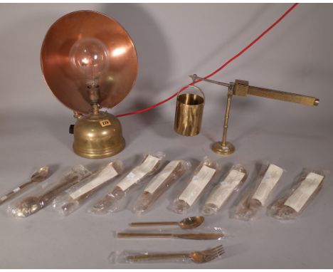 'Tilley Radiators, England', an early 20th century brass heat lamp, 29cm wide x 42cm high and a quantity of bronzeware flatwa
