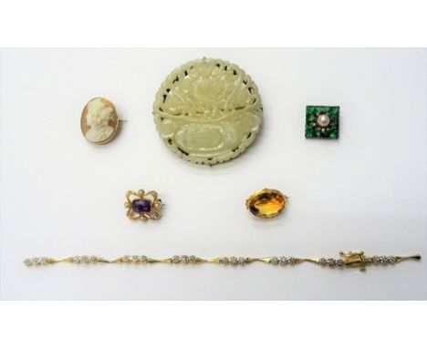 A gold, amethyst and seed pearl set shaped rectangular brooch, detailed 15, a jade brooch, in a carved and pierced circular d