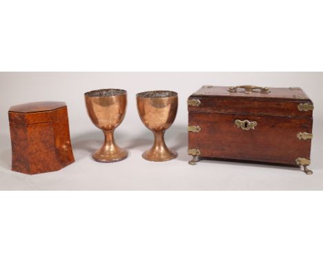 A 19th century oak and brass bound rectangular tea caddy on brass claw feet, 24cm wide x 15cm high, a Regency style burr yew 