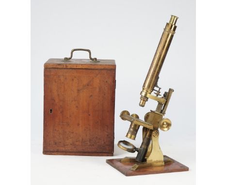 A Hudson &amp; Sons gilt brass microscope, late 19th century, with rack and pinion focusing and fine adjustment in a mahogany
