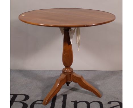 A 19th century walnut tripod table with dished circular top, on outswept supports, 72cm diameter x 66cm high.  A1