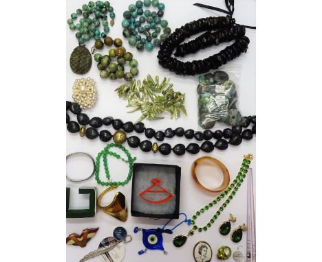 A collection of costume jewellery, including turquoise matrix beads, further bead and other necklaces, a gilt bangle, further