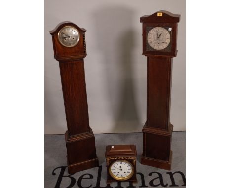 An early 20th century 8 day oak longcase clock, 27cm wide x 135cm high and another similar, 26cm wide x 130cm high and a maho