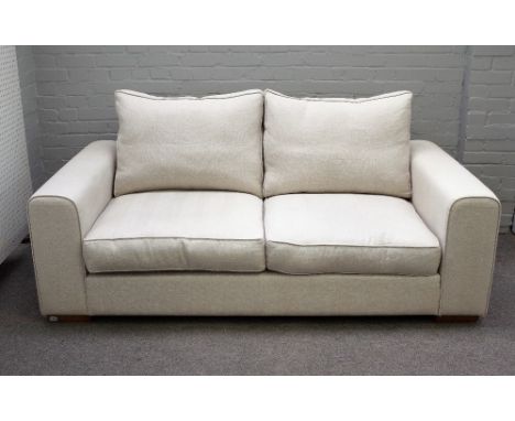 Heals; a Moretta medium seat sofa upholstered in cream fabric on block feet, 195cm wide x 75cm high. 