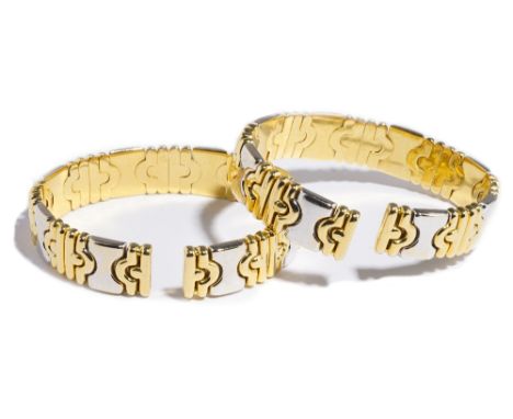 A pair of Italian two colour gold and diamond set sprung bangles, the front of each with diamond set panels, set with circula
