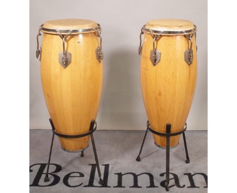 Two similar bongo type drums on stands, (2).