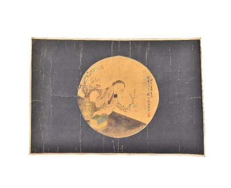 A Chinese circular fan leaf painting, Qing dynasty, ink and watercolour on silk, painted with a young woman seated at a table