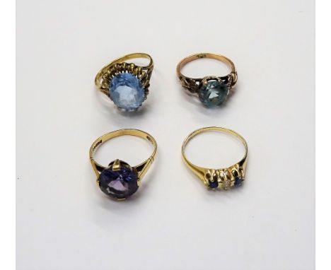 A gold, diamond and pale blue gem set three stone ring and three further gold and varicoloured gem set solitaire rings, combi