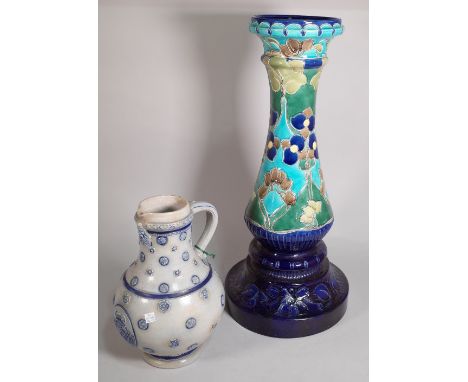 An early 20th century ceramic Art Noveau style jardiniere stand, 19cm wide x 67cm high and a German stoneware jug, 35cm high,