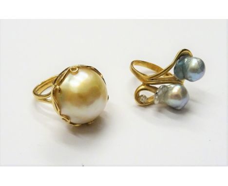 A gold, cultured pearl and diamond set single stone ring, in an abstract twist design, detailed 14 K and a gold ring, mounted