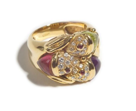 A gold, diamond and cabochon gem set dress ring, designed as three fish heads, set with circular cut diamonds and further set