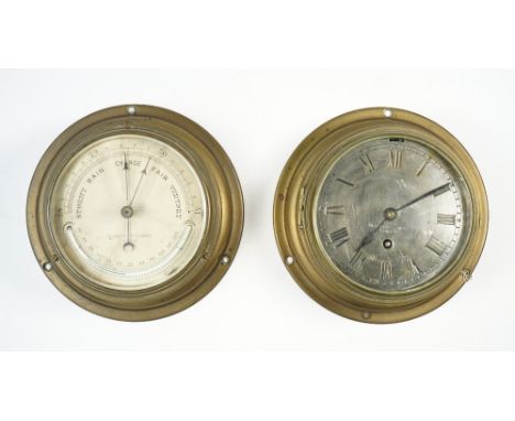 A Negretti and Zambra ships brass cased port hole wall clock, with a 5 inch silvered dial and a similarly cased Negretti and 