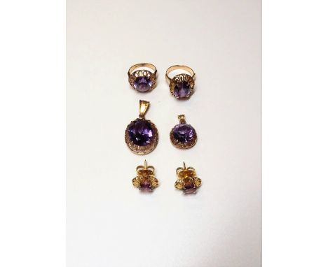 A group of synthetic corundum imitating alexandrite set jewellery, comprising; an oval solitaire pendant, detailed 14 C, a ci
