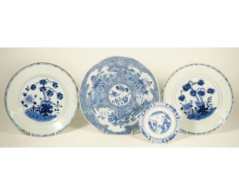 A Chinese blue and white plate, Qianlong, painted with a central panel of flowers and insects against a whorl pattern ground 