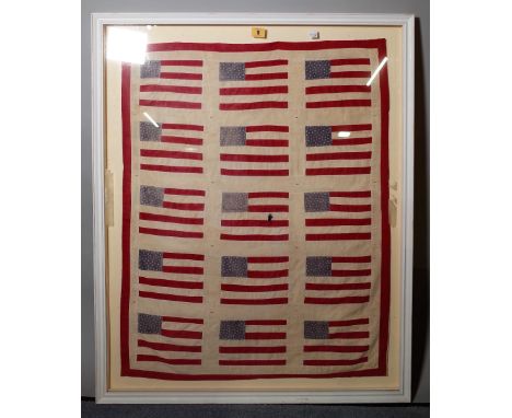 A textile panel 'American flag', framed and glazed, 94 cm x 76 cm overall. A1
