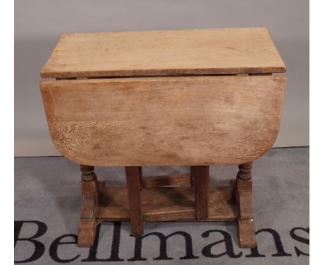 A late 19th century oak drop flap gate leg dining table, 76cm wide x 74cm high.   B2