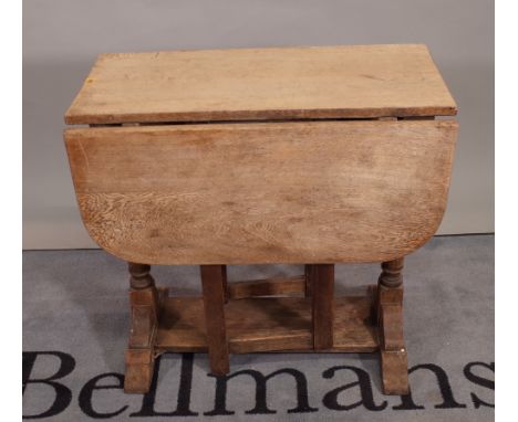 A late 19th century oak drop flap gate leg dining table, 76cm wide x 74cm high.   B2