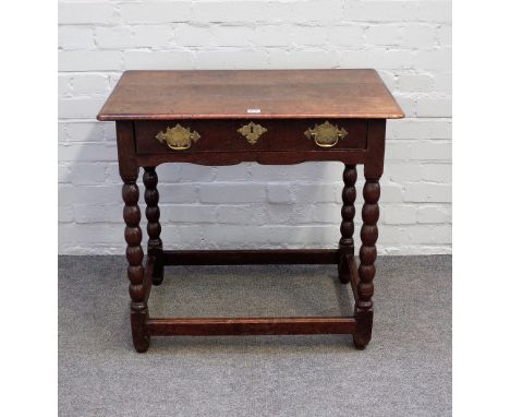 A 17th century oak side table with single frieze drawer on bobbin turned supports, united by perimeter stretcher, 77cm wide 7