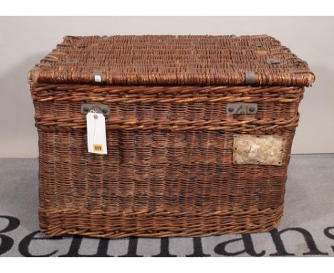 An early 20th century wicker and canvas lined lift top trunk, 79cm wide x 53cm high. 