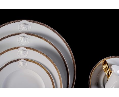 With raised Palazzo motif, gilt trim with Greek key pattern, comprising: 12 under-plates, 12 dinner plates, 12 fish plates, 1