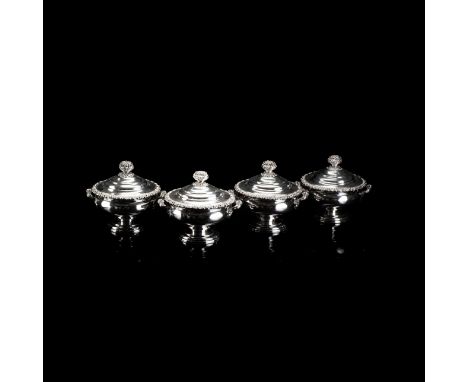 Each stepped cover with foliate finial, the body with foliate rim and opposing handles, raised on a stepped circular foot the