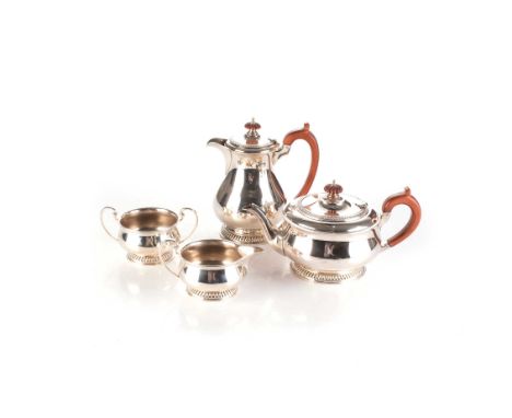 Comprising: a tea pot, hot water pot, milk jug and sugar bowl, each with gadrooned circular footrim, the teapot and hot water