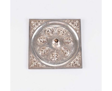 Square, each corner decorated with a seated deity enclosing further figures around a flowering-bud finial10cm square, 41g