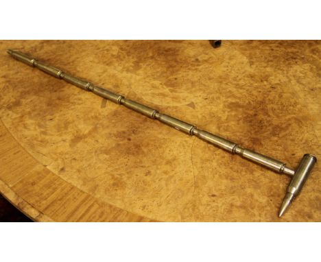 A walking cane / stick construction from .50 calibre bullet casings.