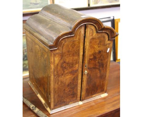 An early 18th Century design walnut cupboard with two doors to front, opening to reveal drawer compartment and shelf.