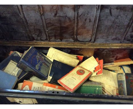 A black metal military box with contents of Penguin books, ordnance survey maps, Alice's Adventures in Wonderland etc