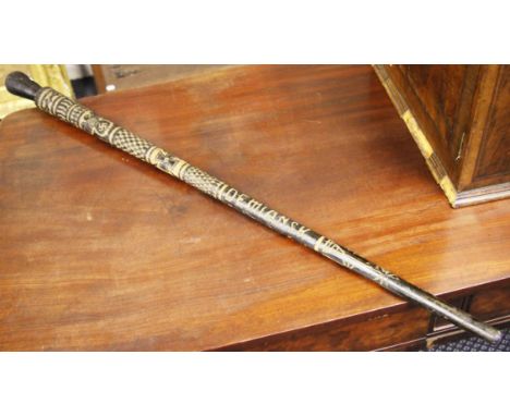 A German Wolchow stick, having carved eagle swastika plus German Iron cross plus engraved to the lower body, Demiansk, Siwer 