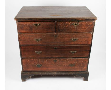 A 19th Century chest of two over three graduating drawers, each having patterned brass drop handles and keyhole plates, all o