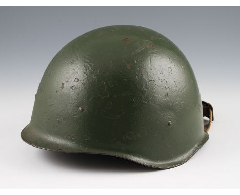 A 1940’s Russian helmet in green with liner, together with a WW2 Czech helmet with liner dated 1938.