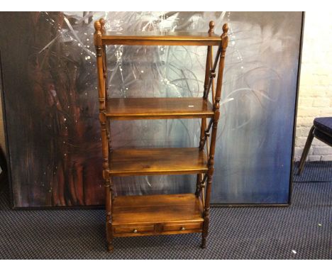 A reproduction mahogany shelf unit fitted with two small drawers.