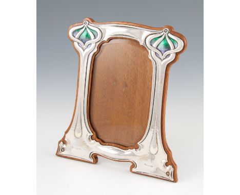 An Art Nouveau silver photograph frame by William Hutton & Sons Ltd., the lobed design featuring areas of original green to p