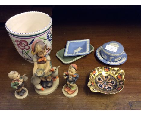 Three Goebel figurines, a Poole vase, a Royal Crown Derby Imari pattern small dish and four small Wedgwood items, two trays, 