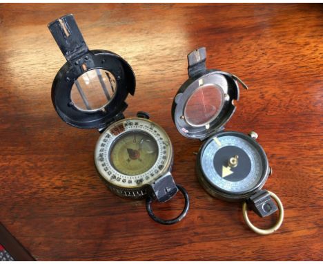 Two military compasses; WW1 compass by S Mordan & Co dated 1917 numbered 62642, and a WW2 compass by T.G.Co Ltd London number