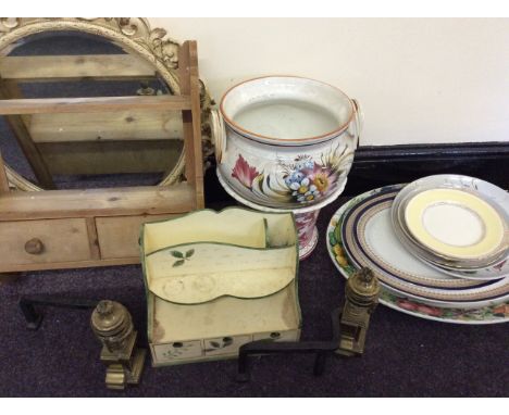 A wall mounted shelf, two cream and gilt mirrors, meat plates, two jardinieres, a spice box and two brass fire dogs. 