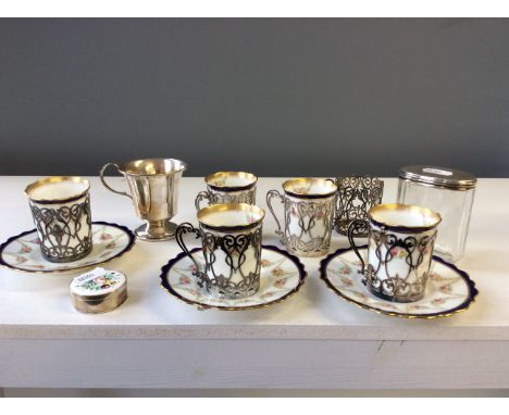 A part Aynsley tea set with six silver pierced cup holders, a silver single handle jug, a silver topped glass pot and a silve